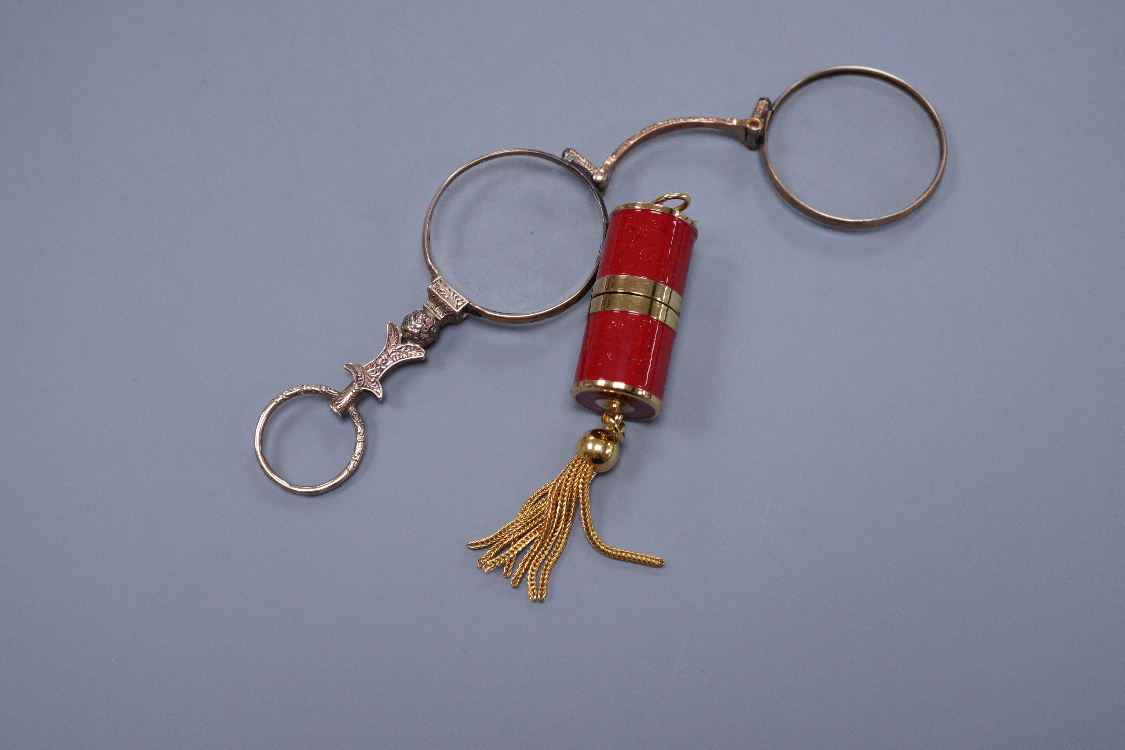 A small gold plated lorgnette, 7.5cm and a J Bogard gilt metal pendant timepiece